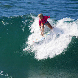 Bethany Hamilton drops into a large wave in Huntington Beach