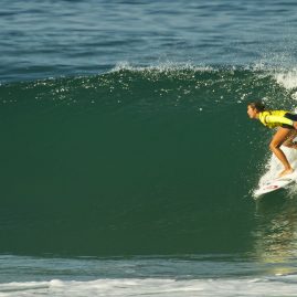Brisa Hennessy charging a wave in Oceanside, CA