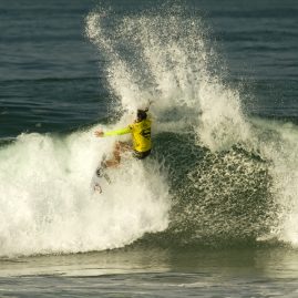 Brisa Hennessy wipesout on a wave