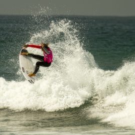 Courtney Conlogue doing a 360 off a wave