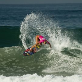Australian surfer, Ellie-Jean Coffey, doing an off-the-lip on a wave