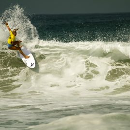 Australian surfer, Felicity Palmateer, drops into a wave in Oceanside, CA