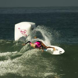 Laura Enever banks off a wave during her surf heat
