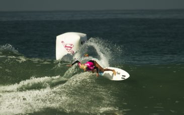 Laura Enever banks off a wave during her surf heat