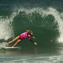 Laura Enever launching off her board