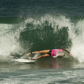 Laura Enever bails off a wave as it closes out.