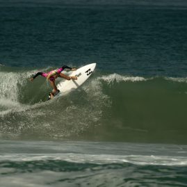 Laura Enever hitting the lip of a wave during her surf heat