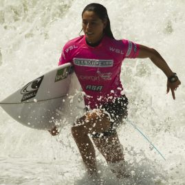 Malia Manuel runs to the beach after her surf heat