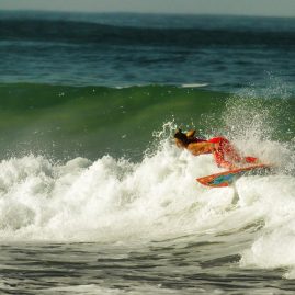 Meah Collins warming up in the surf before her heat