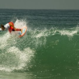 Meah Collins Off the lip during a surf contest