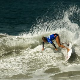 Pauline Ado working a small wave during her surf heat