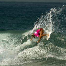 Sage Erickson off the lip in a wave in Oceanside, CA