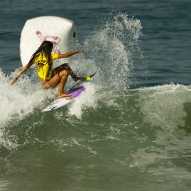 Tanika Hoffman surfing a wave