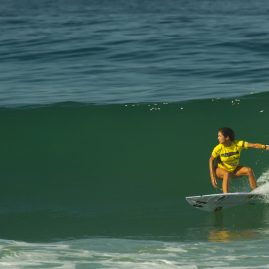 Tanika Hoffman riding a perfect wave