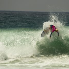 Tatiana Weston-Webb getting air off a wave
