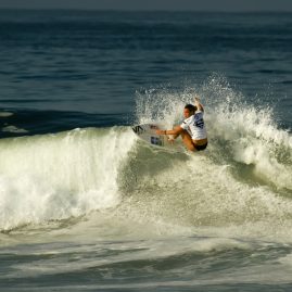 Zoe Mcdougall getting air off a wave
