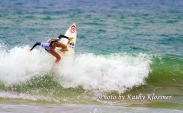 Alana Blanchard doing an Off the Lip at a surf contest