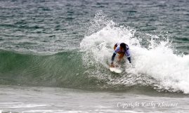 Alessa Quizon dropping into a wave