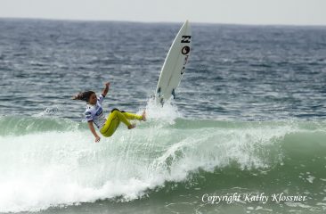 Alessa Quizon flies off her board on a wave