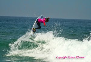 Courtney Conlogue getting air off a wave
