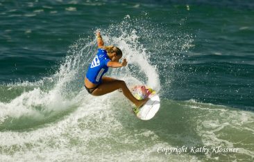 Paige Hareb launching off a wave