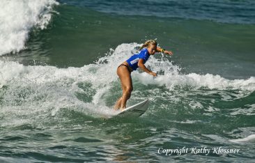 Paige Hareb hopping on a wave in a contest