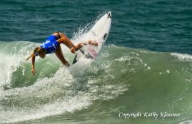 Paige Hareb banking off the lip of a wave