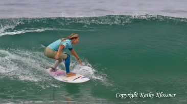 Paige Hareb tucks into a wave