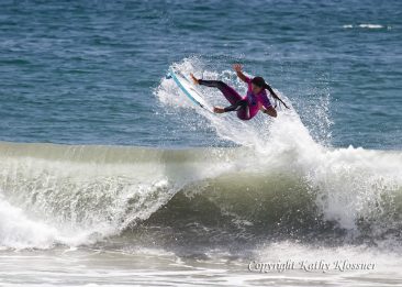 Malia Manuel getting air off a wave