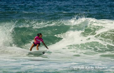 Malia Manuel setting up on a wave