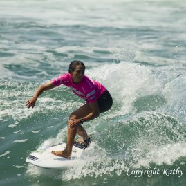 Malia Manuel riding a wave