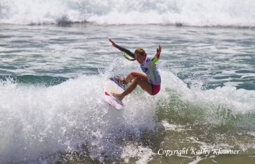 Nikki Van Dijk getting air off a wave