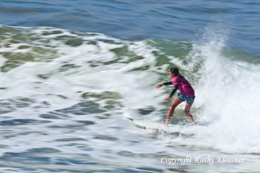 Motion photo of Malia Manuel surfing