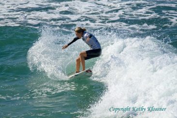 Stephanie Gilmore hopping on a wave