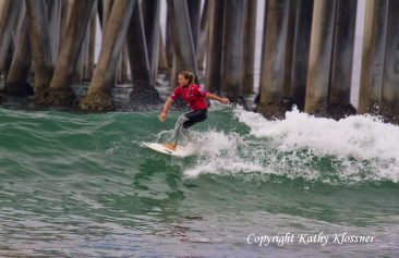 Coco Ho surfing at the Huntinton Beach Pier, CA
