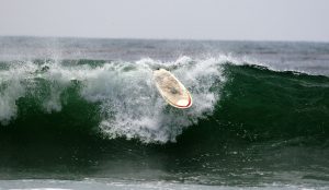 A loose surfboard in the waves