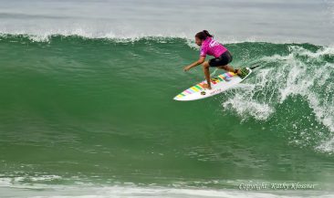 Silvana Lima charging a large wave in California.